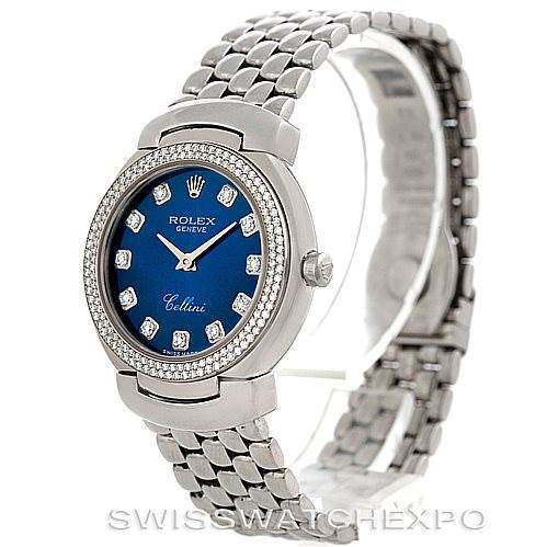 The Rolex Cellini 6671/9 Women's White Gold Blue Dial 6671/9 Women's White Gold Blue Dial watch is shown from a front-angle view, highlighting its blue dial, diamond hour markers, and metal bracelet.