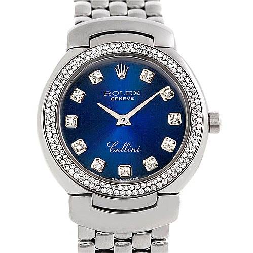 The image shows a front view of a Rolex Cellini 6671/9 Women's White Gold Blue Dial 6671/9 Women's White Gold Blue Dial watch, highlighting its blue dial, diamond hour markers, and a metallic bracelet.