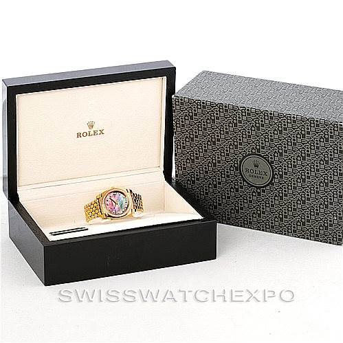 The image shows a Rolex Cellini 6321 Women
s Yellow Gold Mother of Pearl Dial 6321 Women
s Yellow Gold Mother of Pearl Dial watch in an open display box with the outer packaging alongside it.