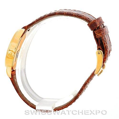 This image shows a side view of the Rolex Cellini 6110 Women's Yellow Gold Beige Dial 6110 Women's Yellow Gold Beige Dial watch, highlighting the leather strap and the gold case.