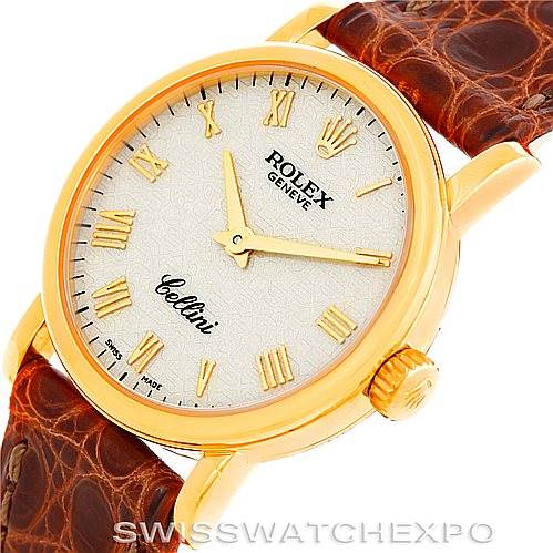 This image shows the face, gold case, crown, and leather strap of a Rolex Cellini 6110 Women's Yellow Gold Beige Dial 6110 Women's Yellow Gold Beige Dial watch at an angled view.