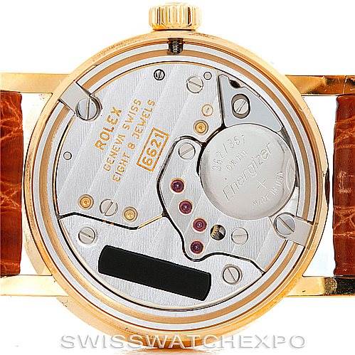 The image shows the back of the Rolex Cellini 6110 Women's Yellow Gold Beige Dial 6110 Women's Yellow Gold Beige Dial watch, revealing the intricate mechanics and internal components of the movement.