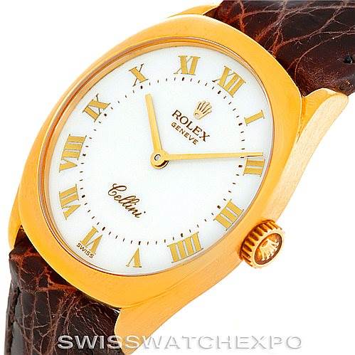 This image shows a close-up, angled view of a Rolex Cellini 4129 Women's Yellow Gold White Dial 4129 Women's Yellow Gold White Dial watch, highlighting the dial, crown, and brown leather strap.