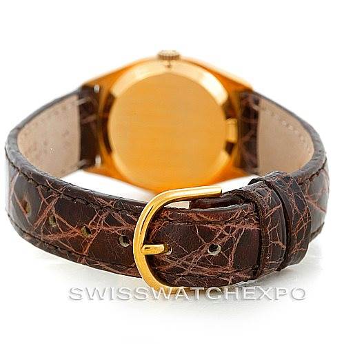 The image shows the back of a Rolex Cellini 4129 Women's Yellow Gold White Dial 4129 Women's Yellow Gold White Dial watch, highlighting its leather strap and gold buckle.