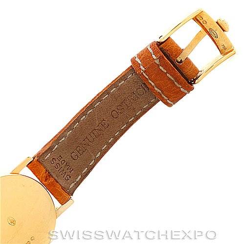 The image shows a partial view of the Rolex Cellini 6110 Women's Yellow Gold Silver Dial 6110 Women's Yellow Gold Silver Dial watch, focusing on the leather strap and the gold buckle.