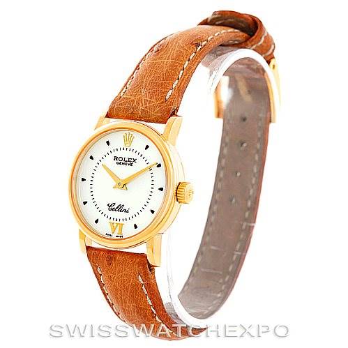 The image shows a Rolex Cellini 6110 Women's Yellow Gold Silver Dial 6110 Women's Yellow Gold Silver Dial watch at an angled side view, highlighting its brown leather strap, gold case, and white dial.
