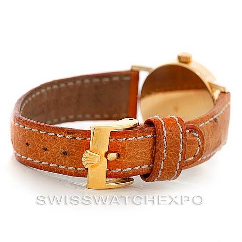 This image shows the back and side view of a Rolex Cellini 6110 Women's Yellow Gold Silver Dial 6110 Women's Yellow Gold Silver Dial watch, focusing on its brown leather strap and gold buckle.