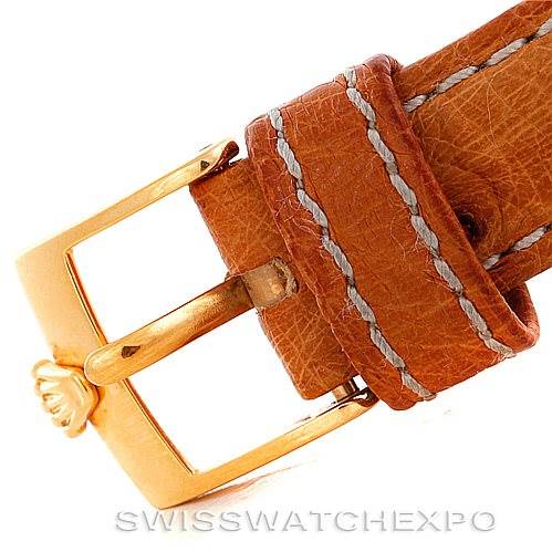 This close-up image shows the clasp and brown leather strap of a Rolex Cellini 6110 Women's Yellow Gold Silver Dial 6110 Women's Yellow Gold Silver Dial watch.