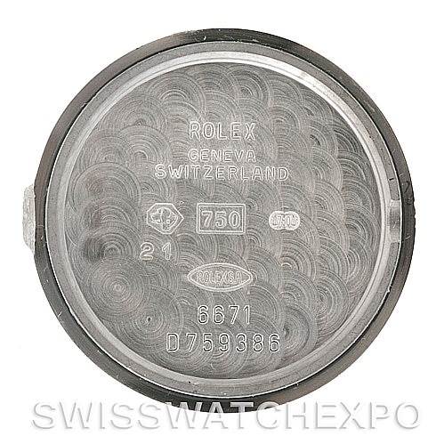 This image shows the inside case back of a Rolex Cellini 6671/9 Women's White Gold Blue Dial 6671/9 Women's White Gold Blue Dial watch, displaying branding, model numbers, and metal composition details.