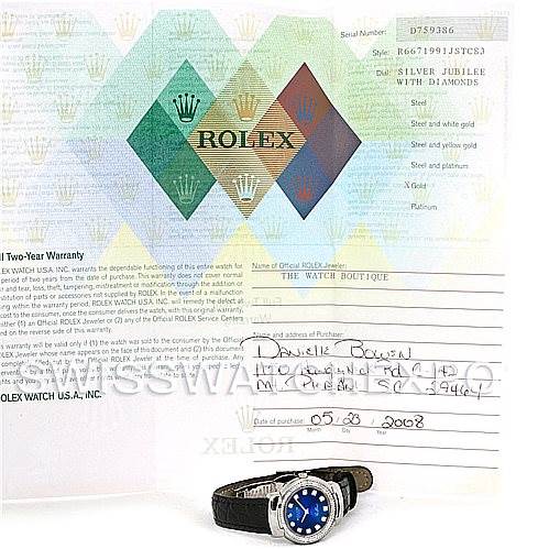 The image shows the Rolex Cellini 6671/9 Women's White Gold Blue Dial 6671/9 Women's White Gold Blue Dial watch and its warranty card displayed from an overhead angle.
