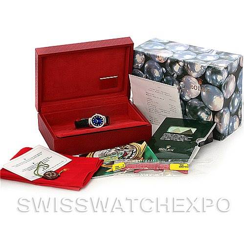 The image shows a Rolex Cellini 6671/9 Women's White Gold Blue Dial 6671/9 Women's White Gold Blue Dial watch in its box, alongside accessories including manuals, a certificate, and packaging materials.