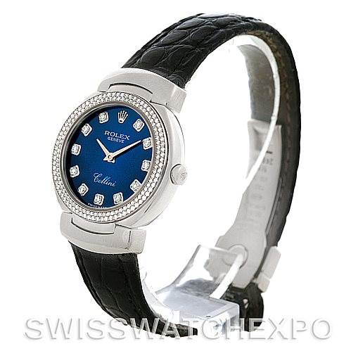 This image shows a Rolex Cellini 6671/9 Women's White Gold Blue Dial 6671/9 Women's White Gold Blue Dial watch from an angle displaying the face, bezel, and black leather strap.