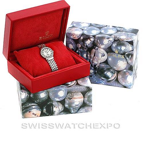 The image shows a Rolex Cellini 6671/9 Women
s White Gold Silver Dial 6671/9 Women
s White Gold Silver Dial watch in a red box, alongside its decorative outer packaging.