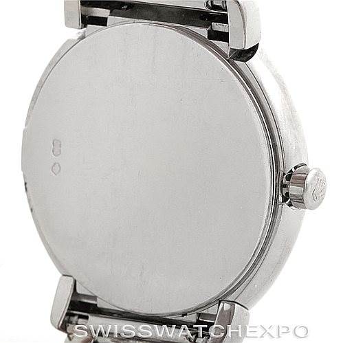 This image shows the back case and crown of a Rolex Cellini 6671/9 Women
s White Gold Silver Dial 6671/9 Women
s White Gold Silver Dial model from an angle where the watch face is not visible.