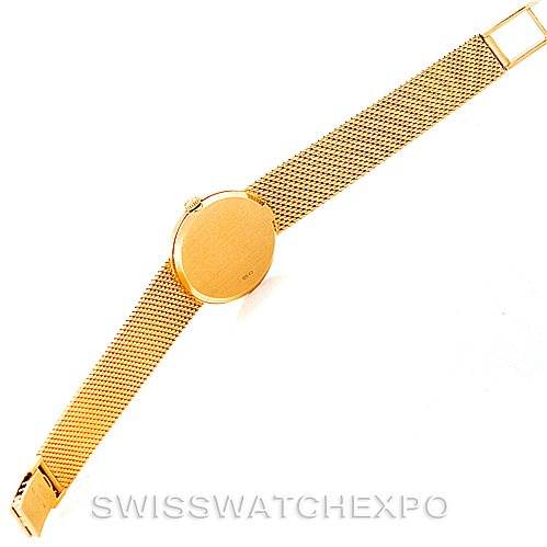 This image shows a top-down view of a Rolex Cellini 4625 Women's Yellow Gold Champagne Dial 4625 Women's Yellow Gold Champagne Dial watch, highlighting its gold mesh bracelet and round watch case.