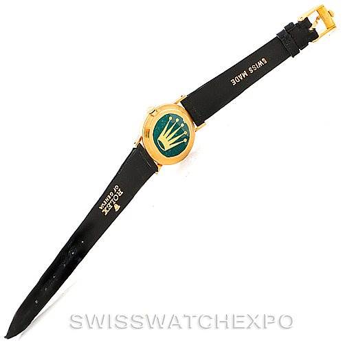 This image shows a top-down view of a Rolex Cellini 4306 Women's Yellow Gold Grey Dial 4306 Women's Yellow Gold Grey Dial watch, focusing on its black leather strap and gold casing.