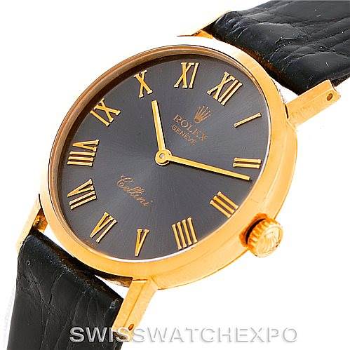 The image shows a Rolex Cellini 4306 Women's Yellow Gold Grey Dial 4306 Women's Yellow Gold Grey Dial watch at an angle focusing on the gold case, black dial with Roman numerals, and a black leather strap.