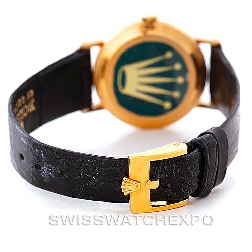 This image shows the back and strap of a Rolex Cellini 4306 Women's Yellow Gold Grey Dial 4306 Women's Yellow Gold Grey Dial, highlighting its buckle and crown emblem on the case back.