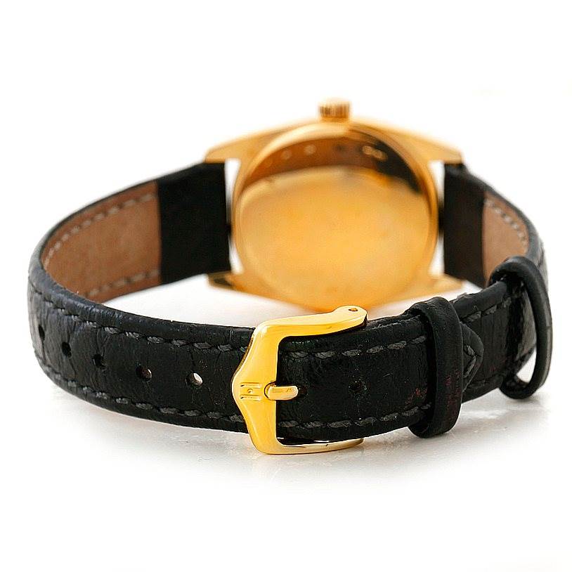 This image shows the back of the Rolex Cellini 6229 Women's Yellow Gold White Dial 6229 Women's Yellow Gold White Dial watch, focusing on the leather strap and gold clasp.