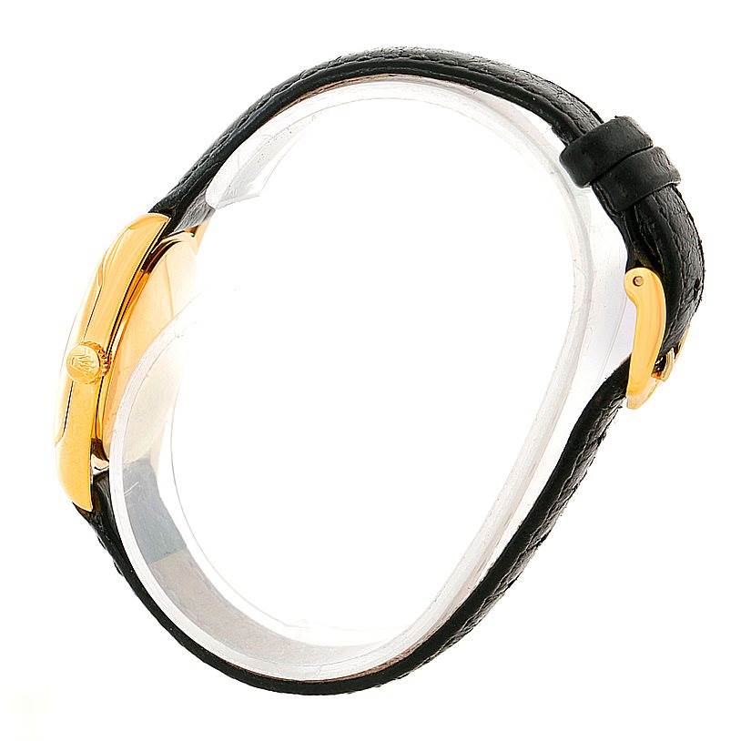 This side view of the Rolex Cellini 6229 Women's Yellow Gold White Dial 6229 Women's Yellow Gold White Dial watch showcases its gold case, crown, and black leather strap.