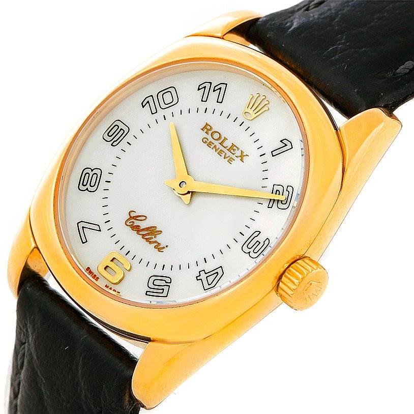 The image shows a close-up angle of the Rolex Cellini 6229 Women's Yellow Gold White Dial 6229 Women's Yellow Gold White Dial watch, featuring its dial, crown, and part of the strap.