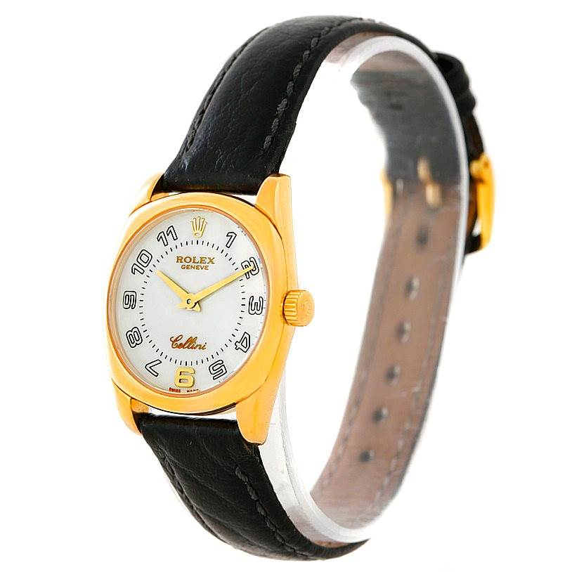 The Rolex Cellini 6229 Women's Yellow Gold White Dial 6229 Women's Yellow Gold White Dial watch is shown at an angled side view, displaying the face, case, and leather strap.