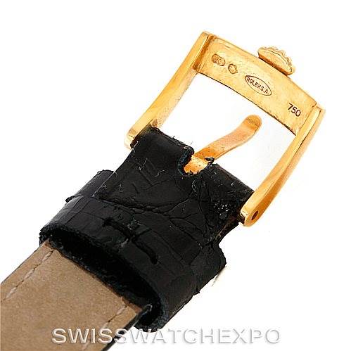 The image shows a gold buckle and part of the leather strap of a Rolex Cellini 6111 Women's Yellow Gold Black Dial 6111 Women's Yellow Gold Black Dial watch.