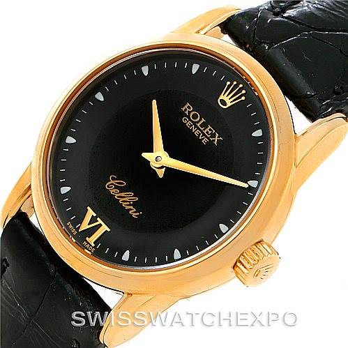 The image shows the face and crown of a Rolex Cellini 6111 Women's Yellow Gold Black Dial 6111 Women's Yellow Gold Black Dial watch at an oblique angle, highlighting its black dial and gold accents.