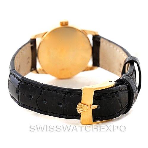 This image shows the back view of a Rolex Cellini 6111 Women's Yellow Gold Black Dial 6111 Women's Yellow Gold Black Dial watch, focusing on the black leather strap and gold clasp.