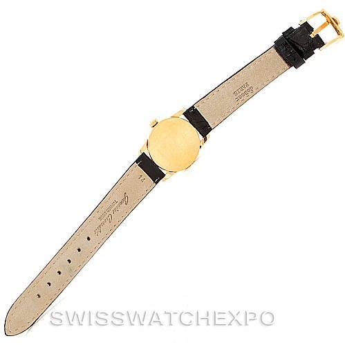 This image shows the back view of a Rolex Cellini 6111 Women's Yellow Gold Black Dial 6111 Women's Yellow Gold Black Dial watch with its full leather strap visible.