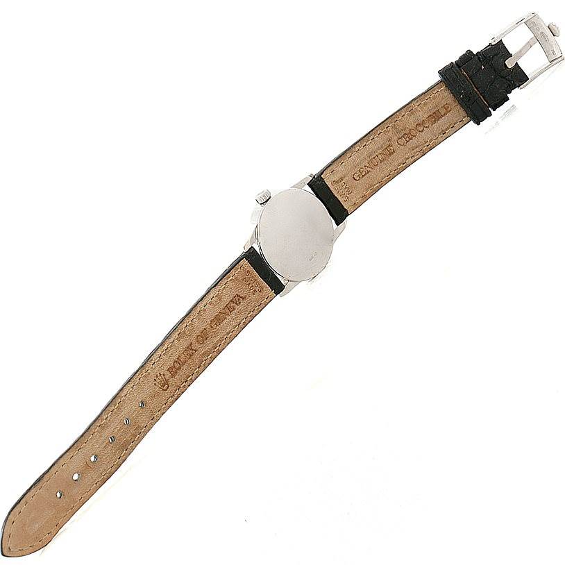 The image shows the back view of the Rolex Cellini 6111 Women's White Gold Silver Dial 6111 Women's White Gold Silver Dial watch, highlighting its leather strap and the case back.