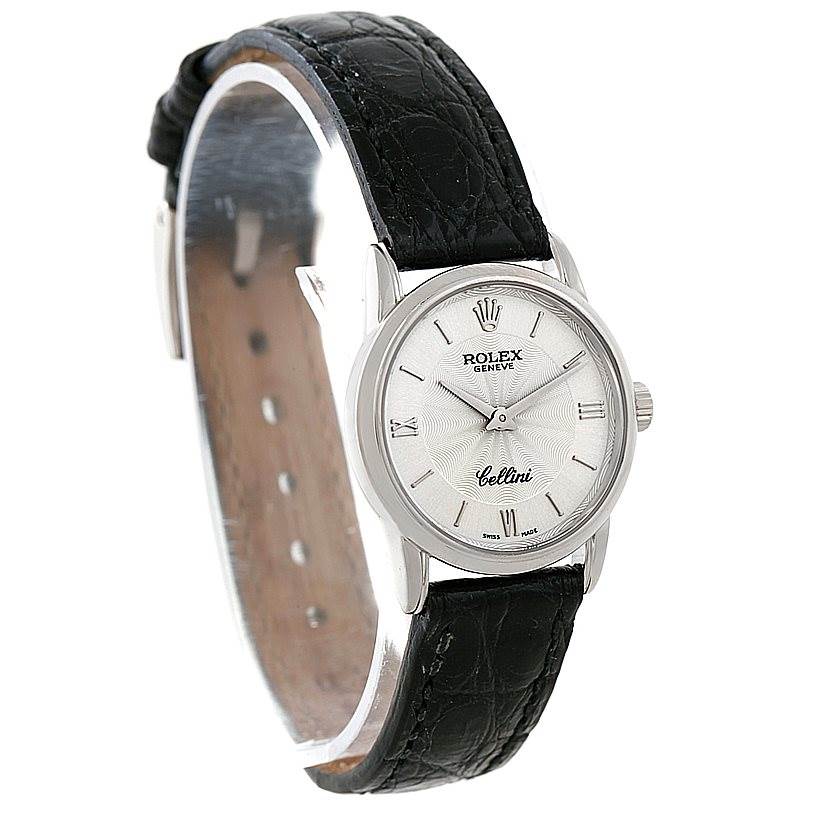 This image shows a Rolex Cellini 6111 Women's White Gold Silver Dial 6111 Women's White Gold Silver Dial watch angled from the front-left side, displaying the face, bezel, and black leather strap.