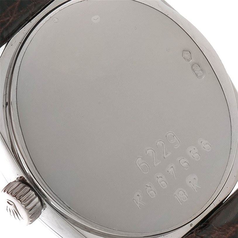 This image shows the case back and crown of a Rolex Cellini 6229 Women's White Gold White Dial 6229 Women's White Gold White Dial watch.