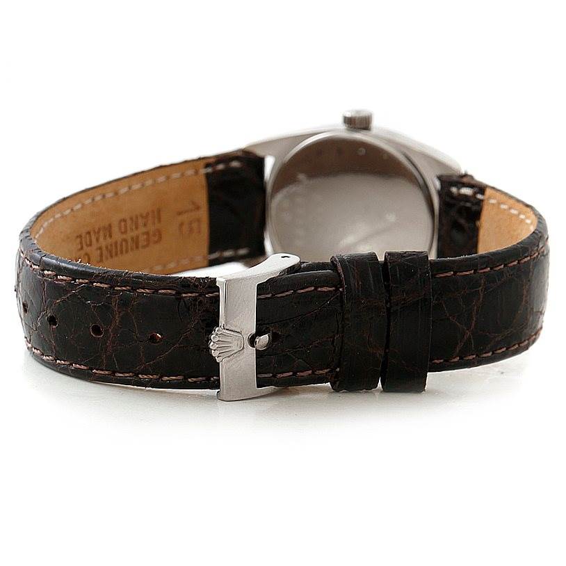 The image shows the back side and strap of a Rolex Cellini 6229 Women's White Gold White Dial 6229 Women's White Gold White Dial watch, highlighting the leather band and clasp.