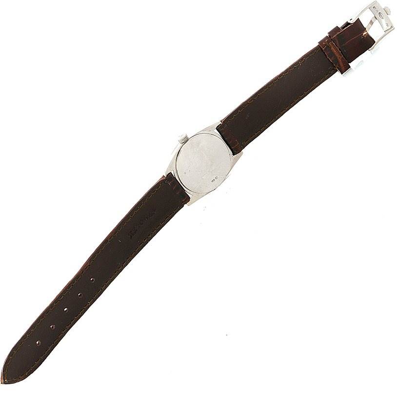 The image shows the back of a Rolex Cellini 6229 Women's White Gold White Dial 6229 Women's White Gold White Dial watch, featuring its leather strap and buckle.