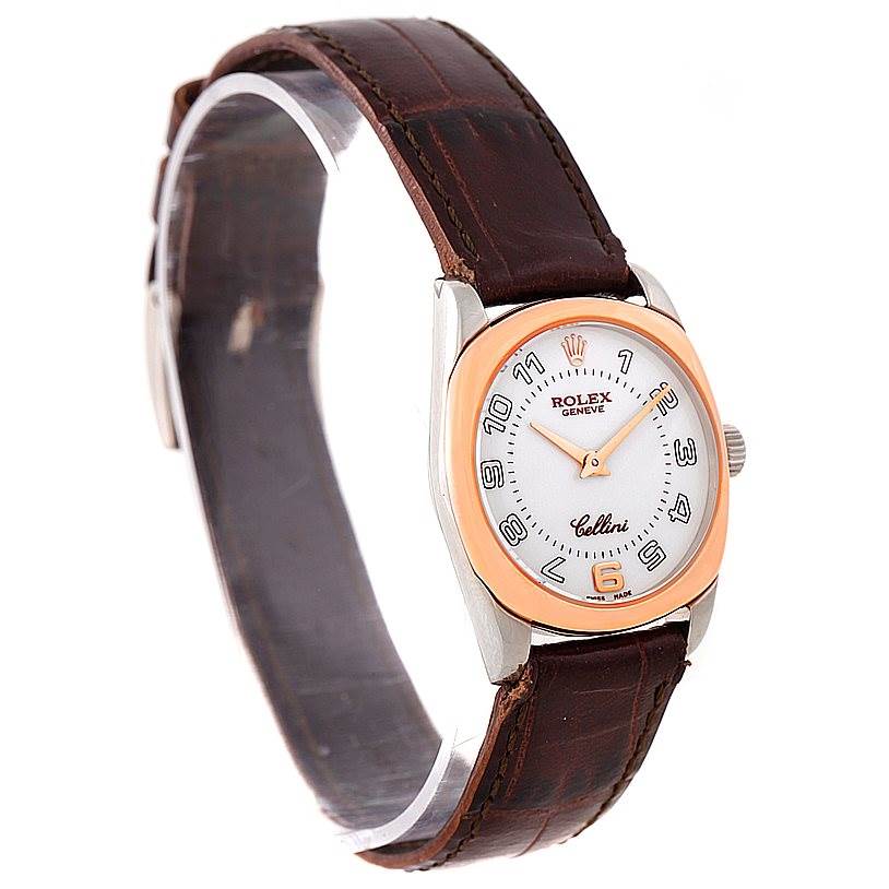 The Rolex Cellini 6229 Women's White Gold White Dial 6229 Women's White Gold White Dial watch is shown from a slight angle, highlighting its face, crown, and leather strap.