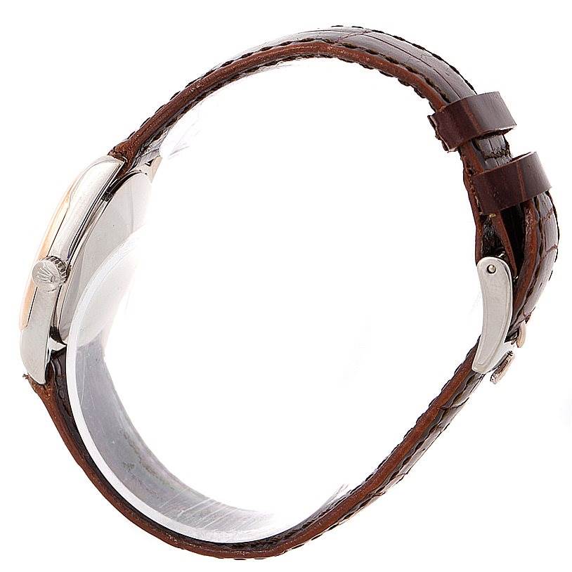 This image shows a side profile view of a Rolex Cellini 6229 Women's White Gold White Dial 6229 Women's White Gold White Dial watch, highlighting its case, crown, and brown leather strap.