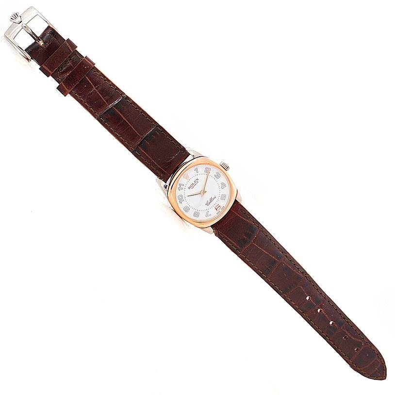 The Rolex Cellini 6229 Women's White Gold White Dial 6229 Women's White Gold White Dial watch is shown from a top-down angle, displaying the face, case, crown, and full leather strap.