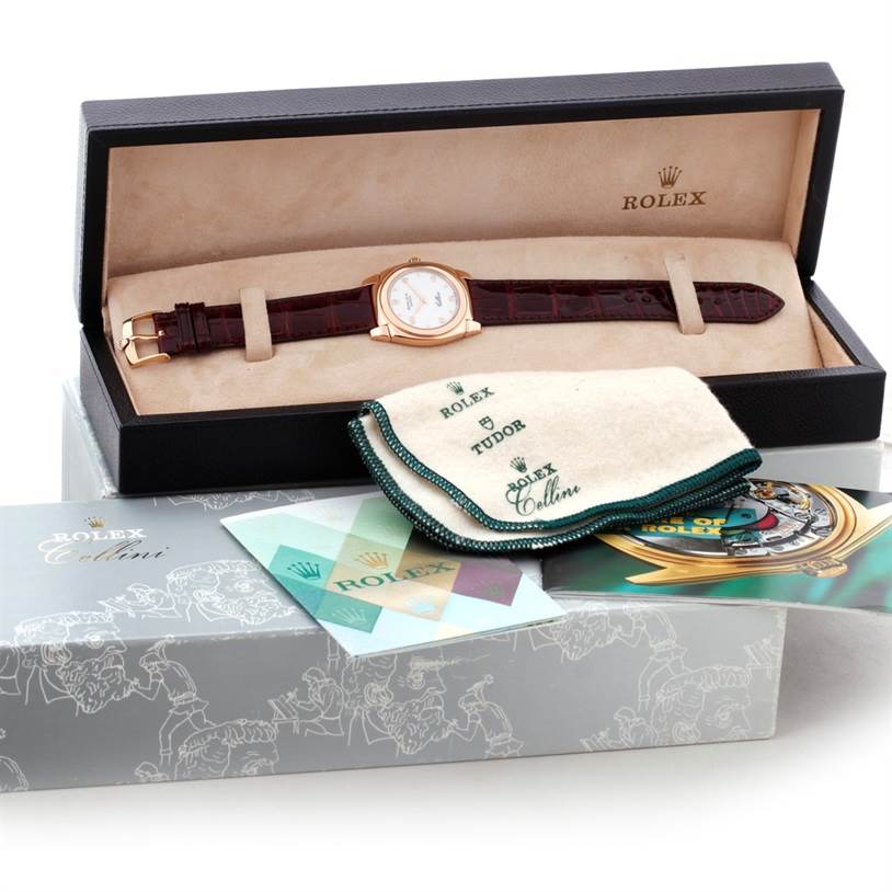 The Rolex Cellini 5320 Rose Gold White Dial 5320 Rose Gold White Dial watch is shown in its box, accompanied by a cleaning cloth and documents, all photographed from a top angle.