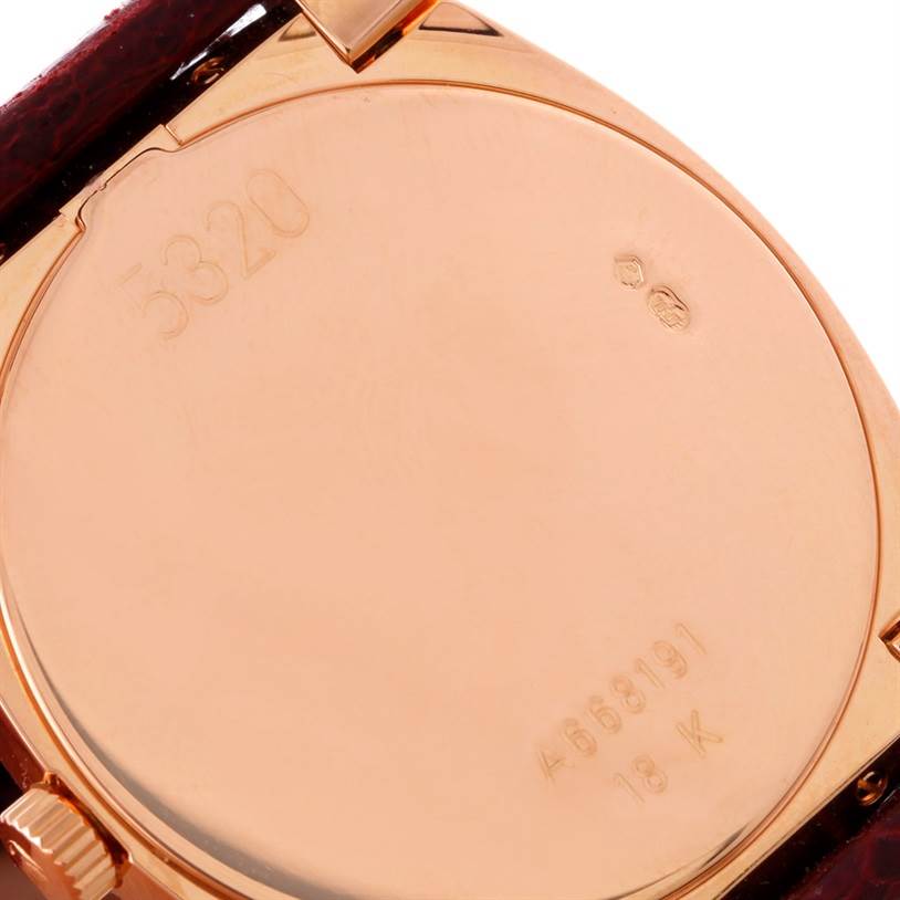 This image shows the case back of a Rolex Cellini 5320 Rose Gold White Dial 5320 Rose Gold White Dial watch, highlighting the engraved serial number and 18K gold marking.