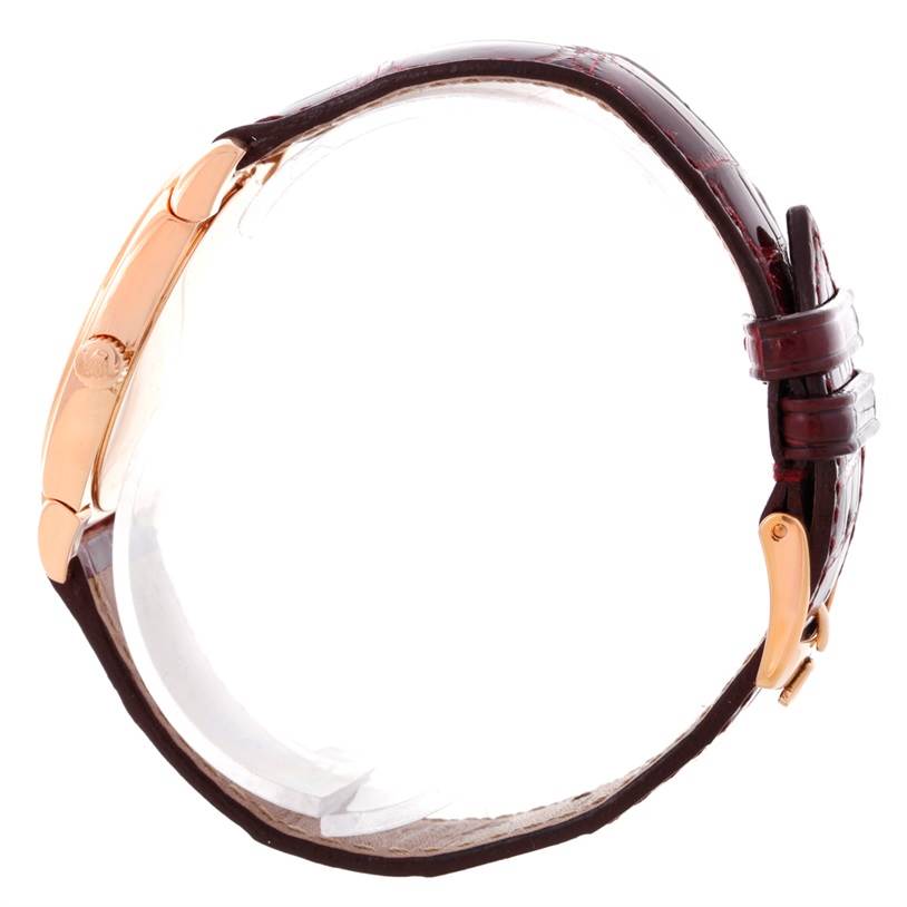 This side view of the Rolex Cellini 5320 Rose Gold White Dial 5320 Rose Gold White Dial watch displays its case and leather strap.