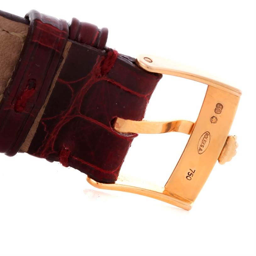 The image shows a close-up of a leather strap and gold buckle from a Rolex Cellini 5320 Rose Gold White Dial 5320 Rose Gold White Dial watch.