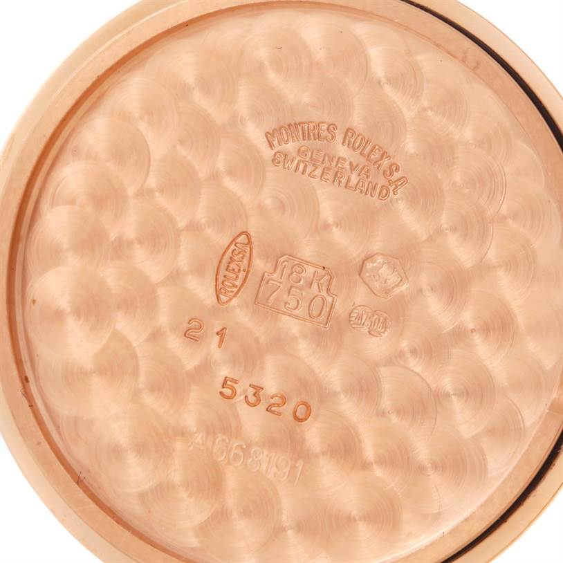 This image shows the inner case back of a Rolex Cellini 5320 Rose Gold White Dial 5320 Rose Gold White Dial model, featuring various engravings and hallmarks.