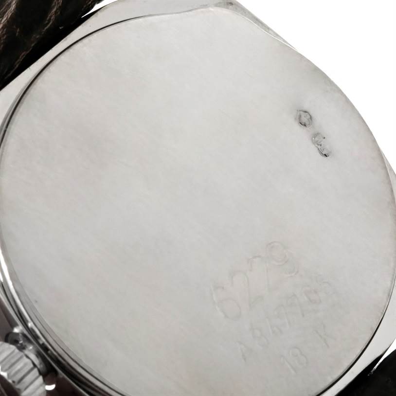 This image shows the back case of a Rolex Cellini 6229 Women's White Gold White Dial 6229 Women's White Gold White Dial watch, highlighting the inscriptions and markings on it.