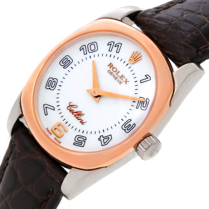 This is a Rolex Cellini 6229 Women's White Gold White Dial 6229 Women's White Gold White Dial watch shown at an angle displaying the face, crown, and part of the leather strap.