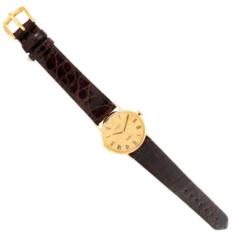 The image shows a Rolex Cellini 3810 Women's Yellow Gold Champagne Dial 3810 Women's Yellow Gold Champagne Dial watch at an angled top-down view, displaying the dial, case, and leather strap.