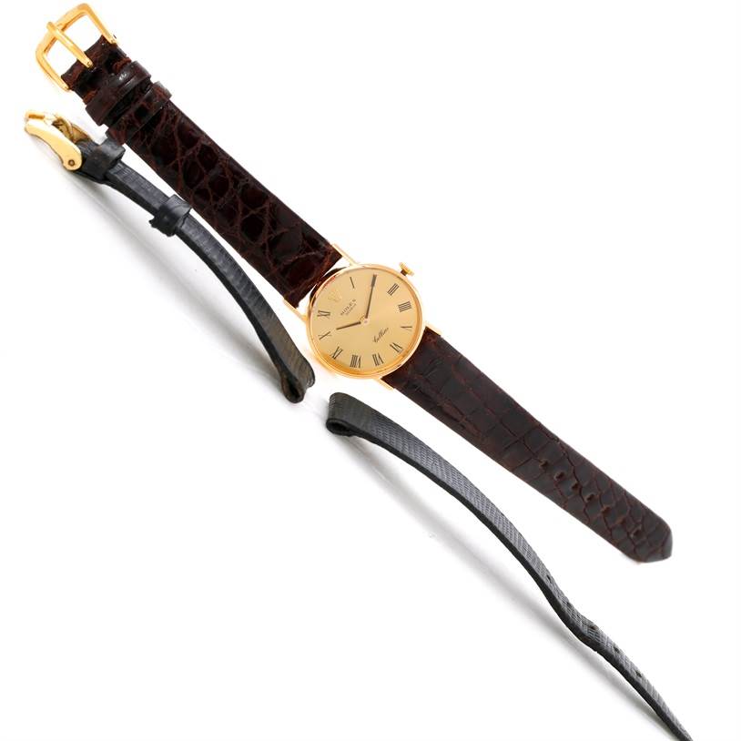 The image shows a Rolex Cellini 3810 Women's Yellow Gold Champagne Dial 3810 Women's Yellow Gold Champagne Dial watch laid flat, along with two additional straps viewed from a top-down angle.