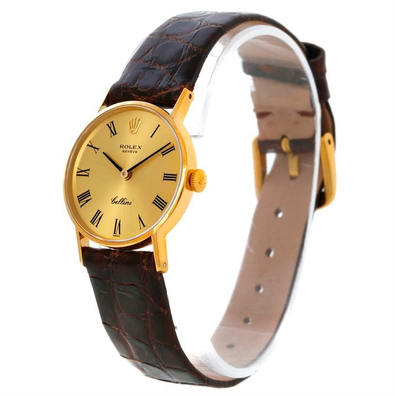 The image shows a side angle view of the Rolex Cellini 3810 Women's Yellow Gold Champagne Dial 3810 Women's Yellow Gold Champagne Dial watch, highlighting its gold face, Roman numerals, and leather strap.