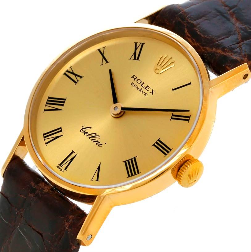 This image shows a Rolex Cellini 3810 Women's Yellow Gold Champagne Dial 3810 Women's Yellow Gold Champagne Dial watch at an angled view, highlighting its gold bezel, crown, dial, and leather strap.