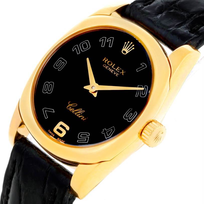 The Rolex Cellini 6229 Women's Yellow Gold Black Dial 6229 Women's Yellow Gold Black Dial watch is shown at an angled view, highlighting its black dial, gold case, crown, and black leather strap.